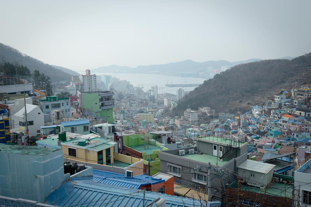 girl posing beside seoul art installation